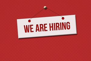Door sign saying "we are hiring"